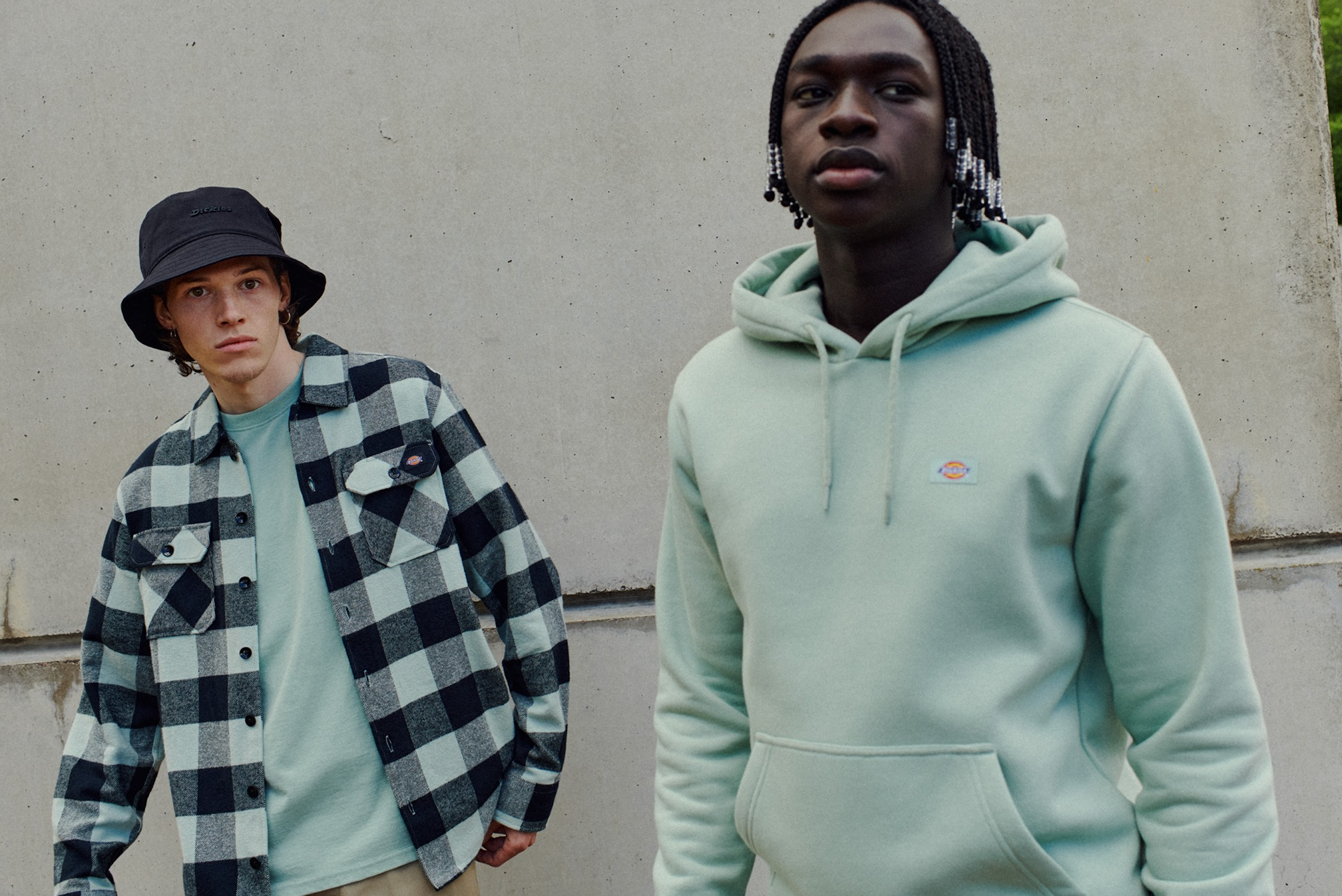 Men’s casual outfit with green hoodie and check flannel shirt, available at Replay Menswear