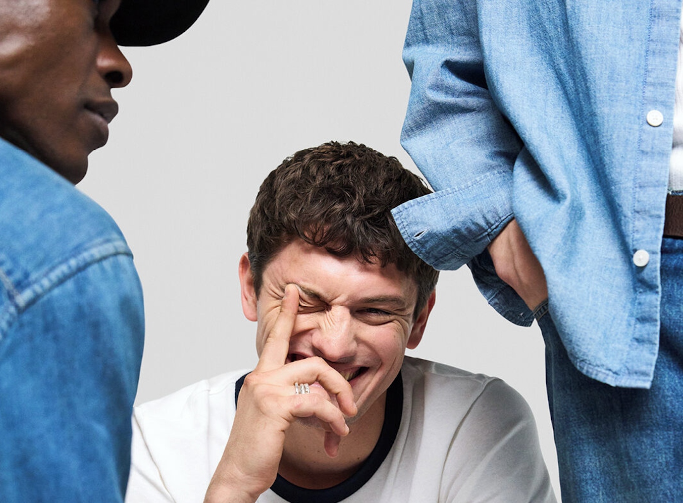 Jack & Jones menswear featuring a white t-shirt and denim styles worn by models in a relaxed studio setting